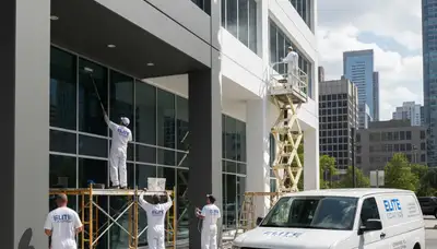 Professional commercial painters finishing office building exterior in Denver, CO